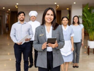 Professional household staff team standing together in a luxury setting.