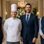 Professional hospitality and household staffing team including a chef and service professionals in a luxury setting.