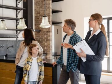 Professional household staffing consultant discussing home staffing requirements with a family.