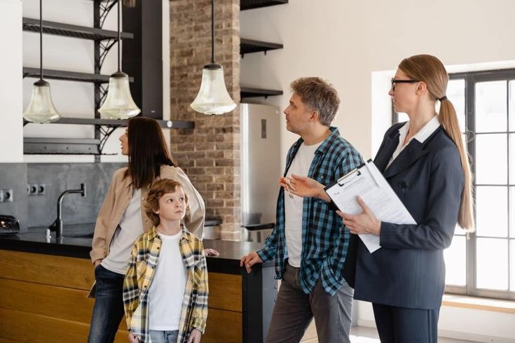 Professional household staffing consultant discussing home staffing requirements with a family.